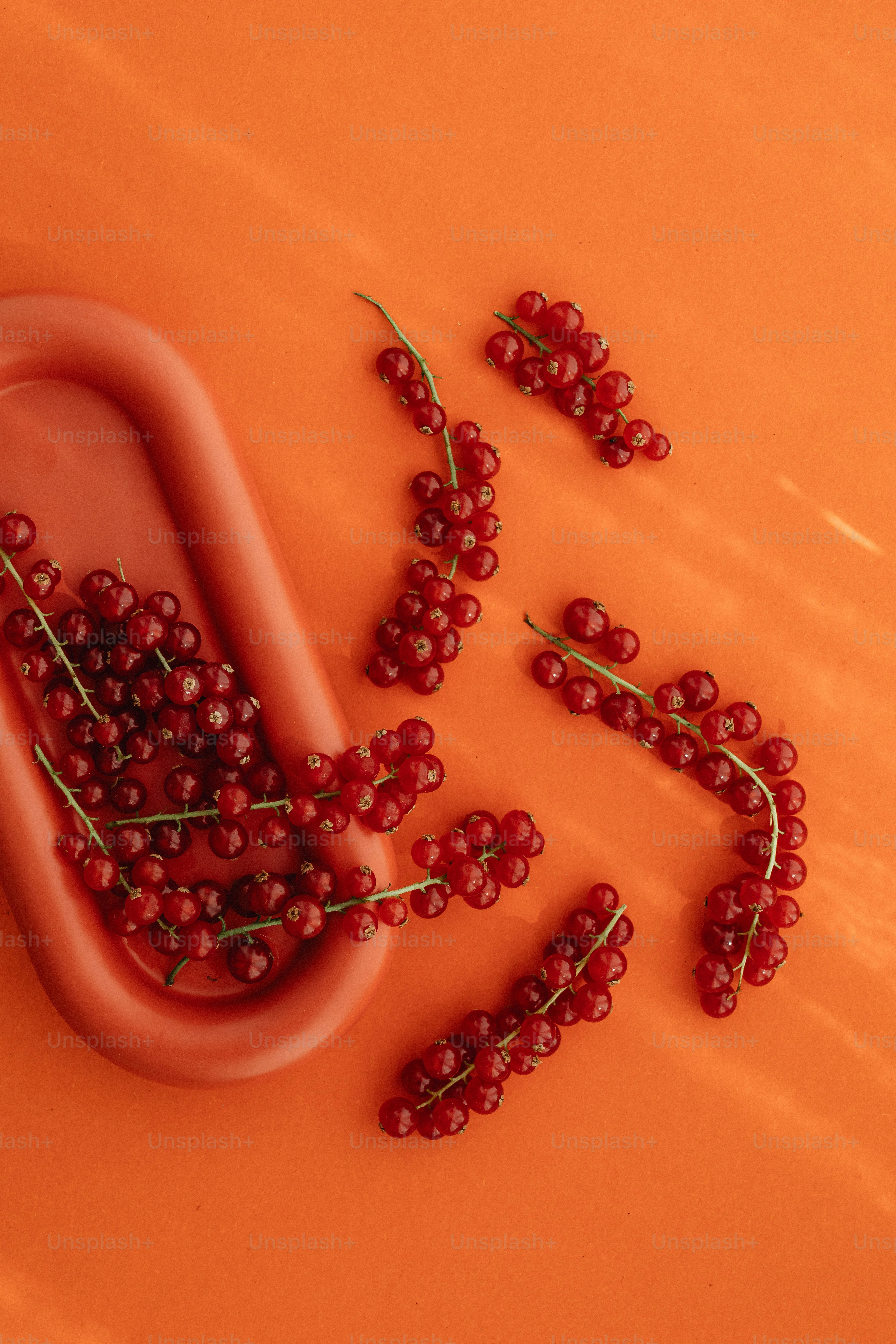 a bunch of red berries sitting on top of a table