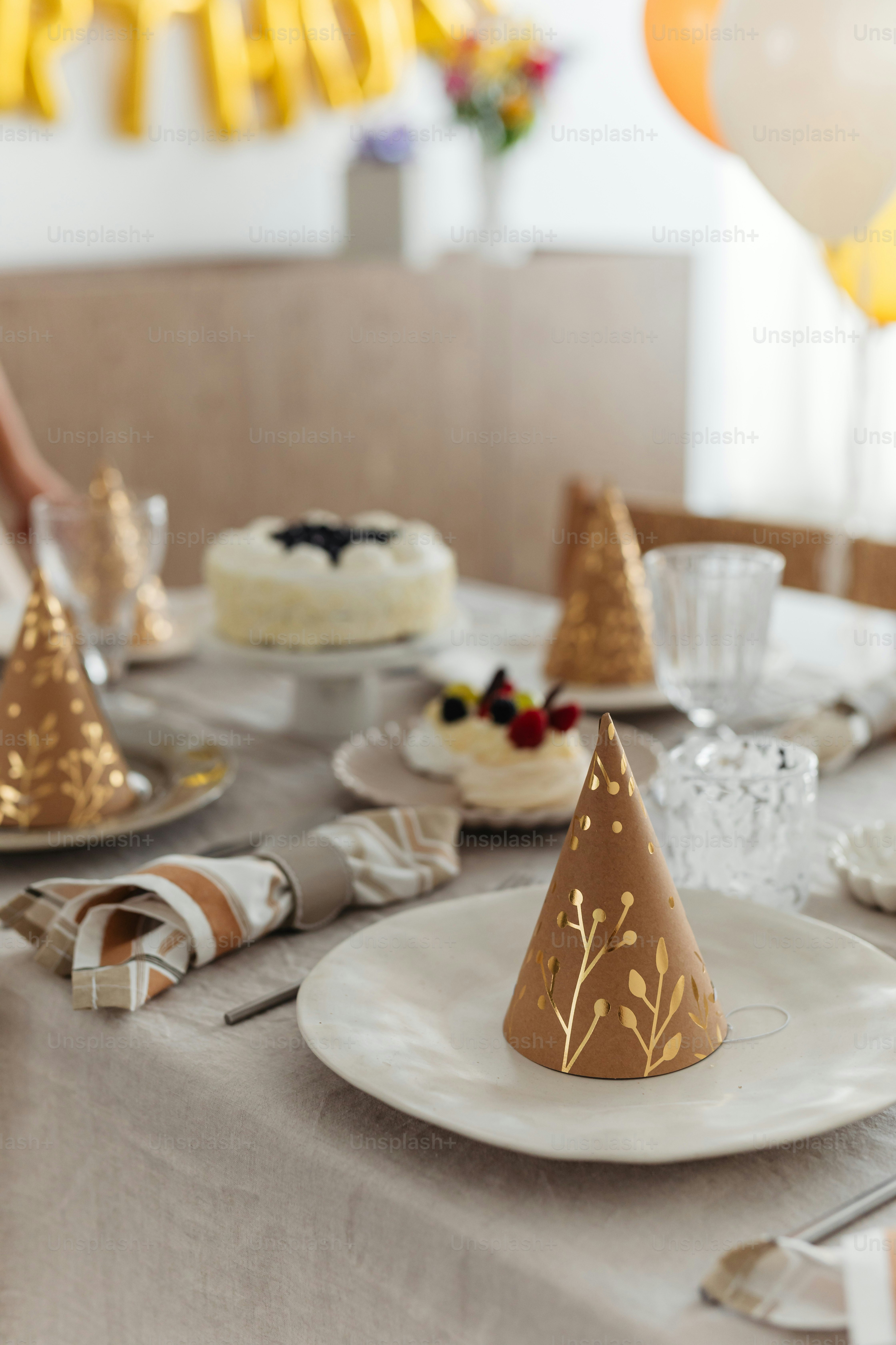 a table topped with a white plate covered in cake