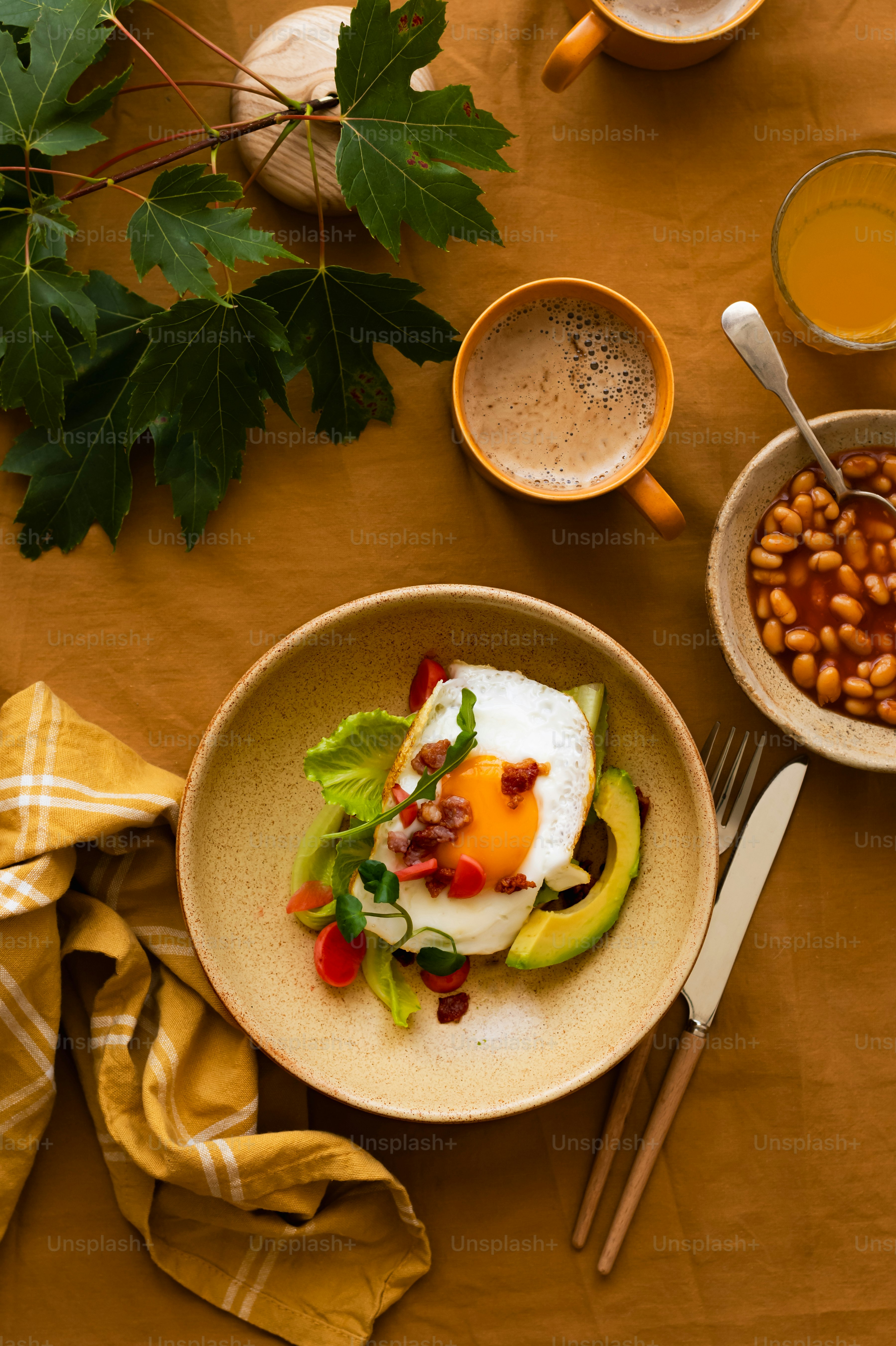 a table topped with bowls of food and drinks