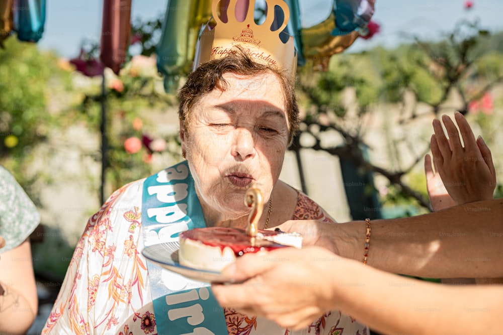 a woman in a tiara is eating cake