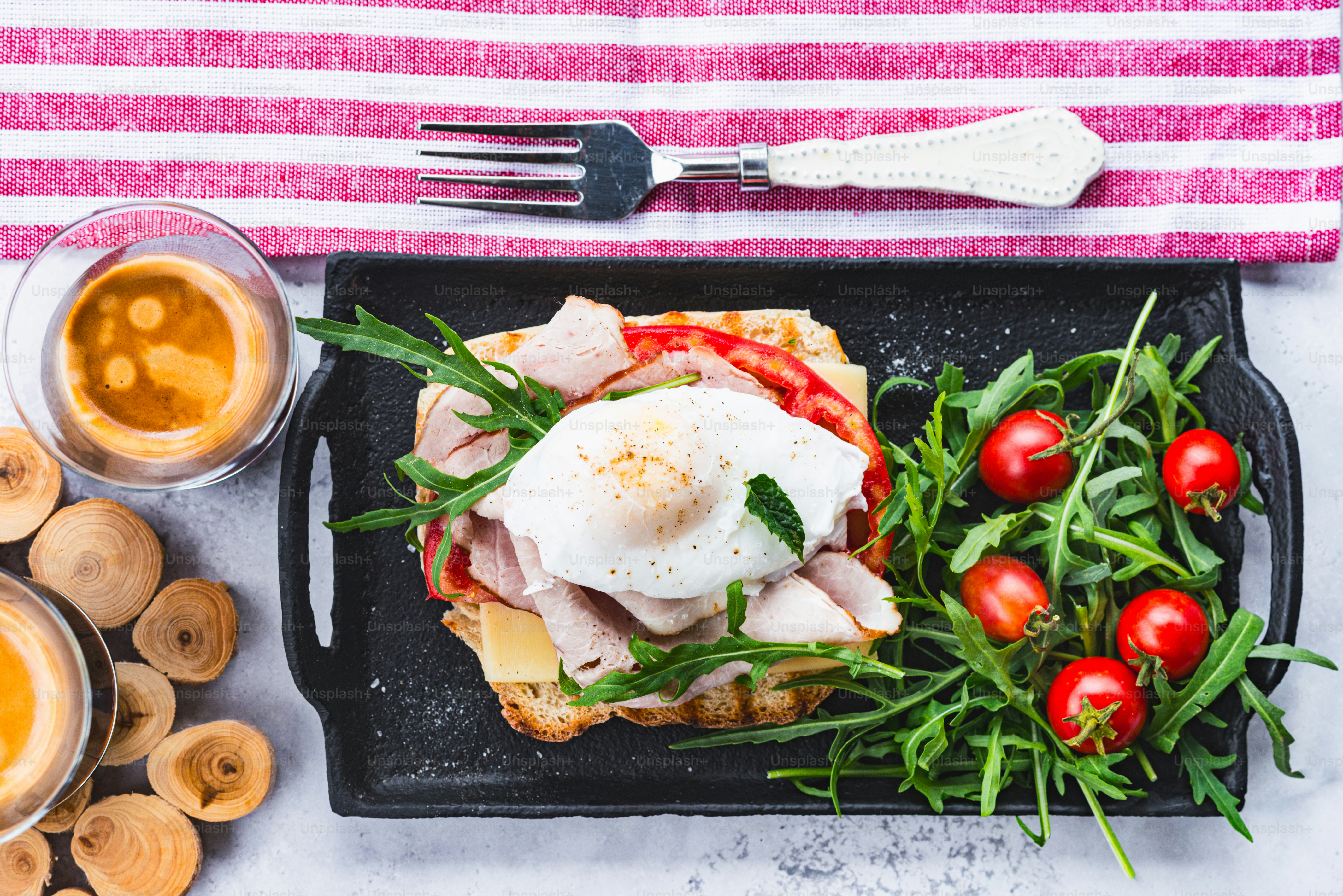 a plate of food on a table with a fork and knife