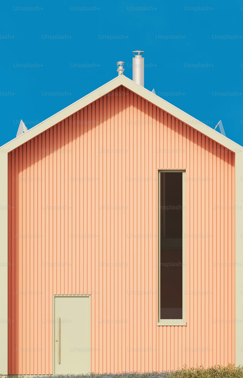 un bâtiment rose avec une horloge sur le devant
