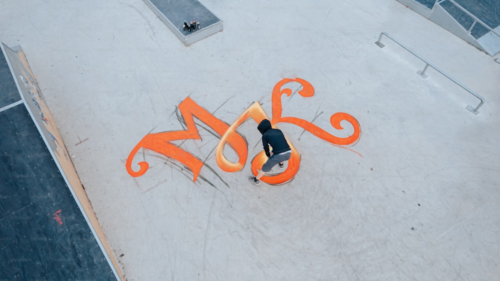 a man riding a skateboard on top of a ramp