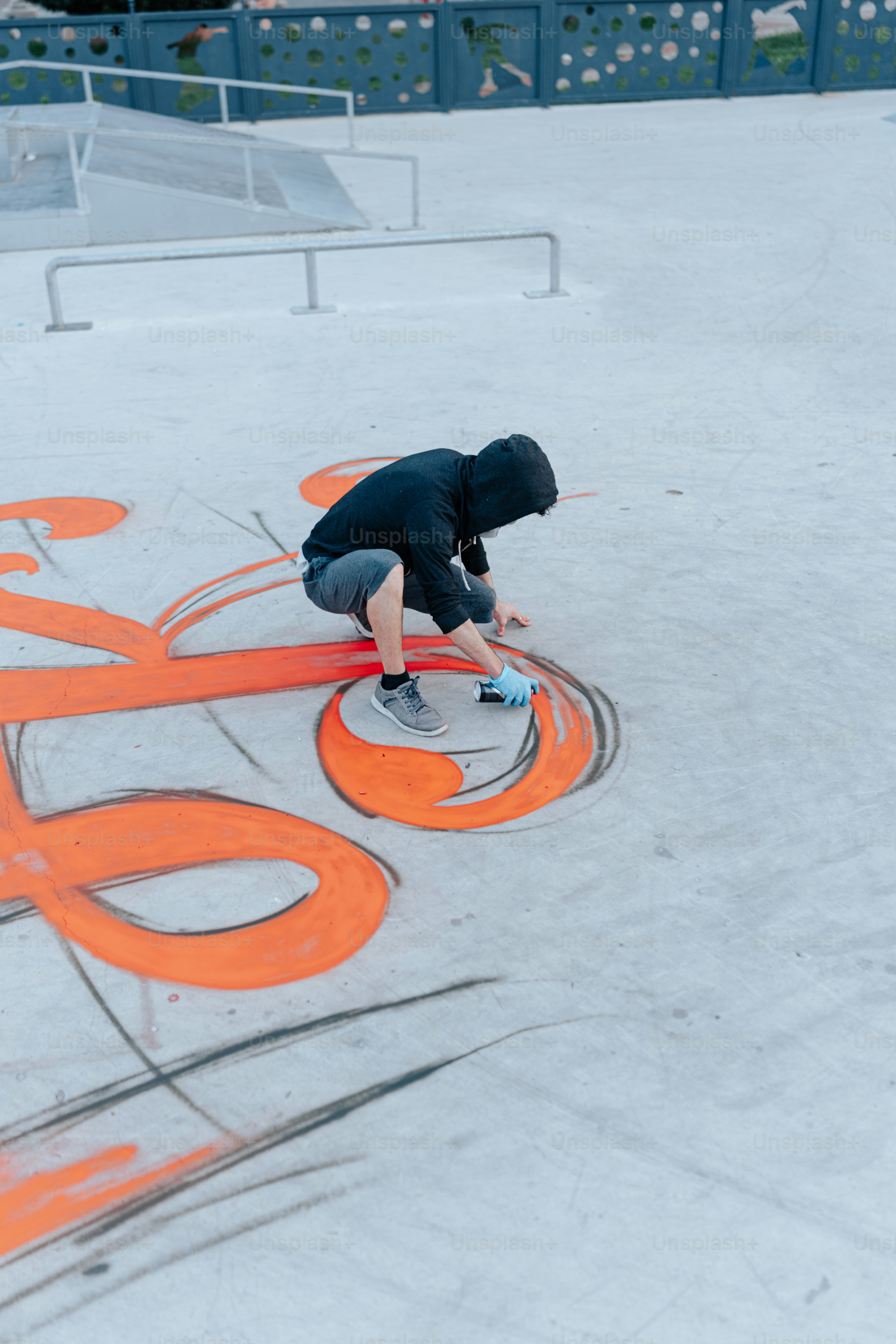 a man riding a skateboard on top of a ramp