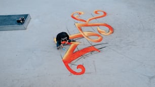 a skateboarder is doing a trick on a ramp