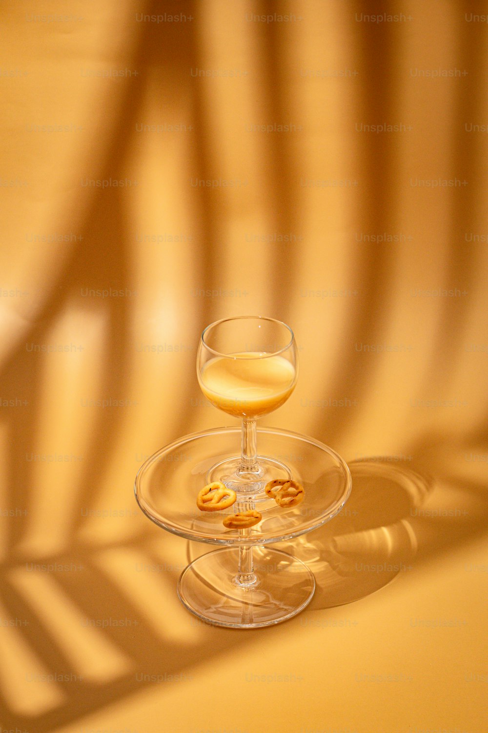 a glass of wine sitting on top of a table