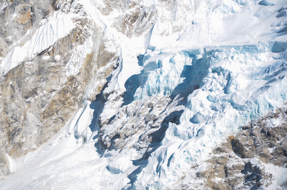 an aerial view of a snow covered mountain