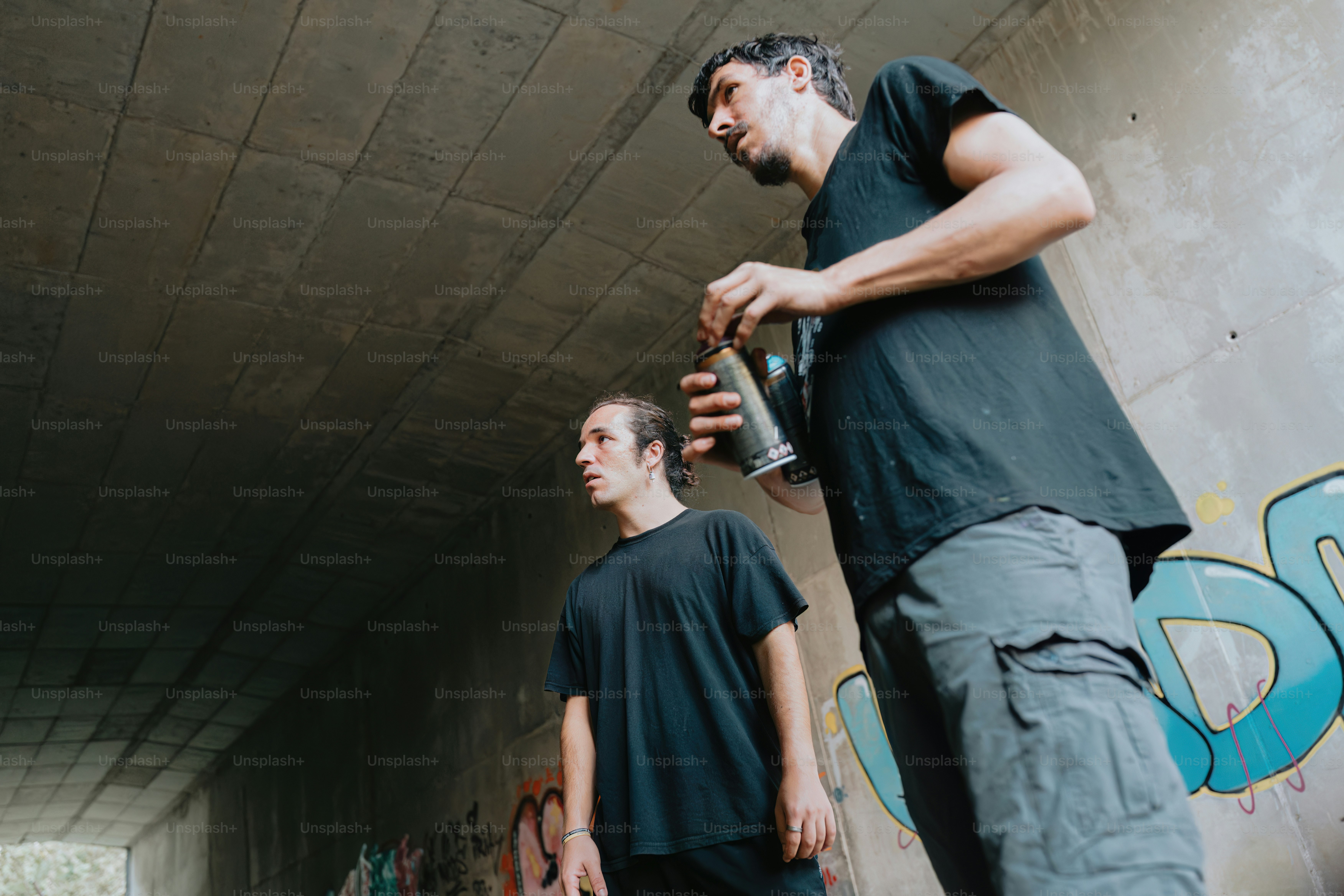 a couple of men standing next to each other