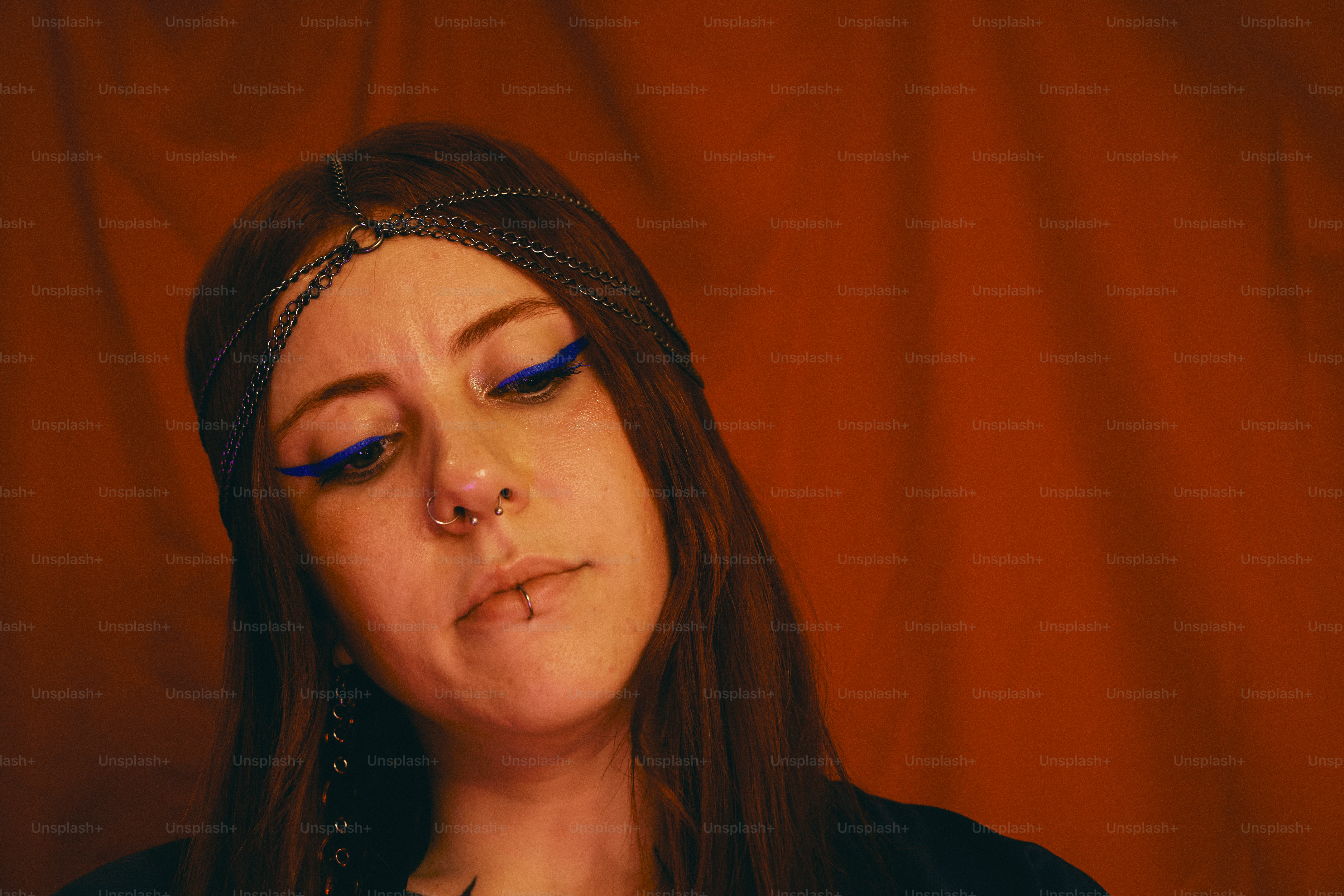 a woman with blue eyes and a headband