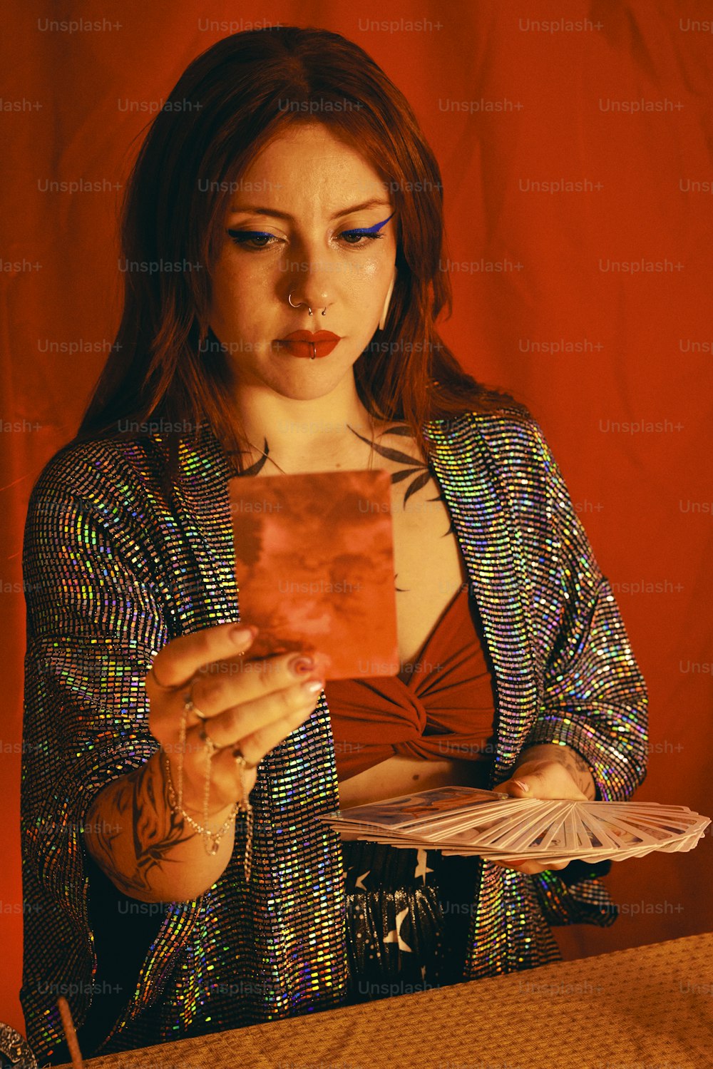 a woman holding a piece of paper in her hands