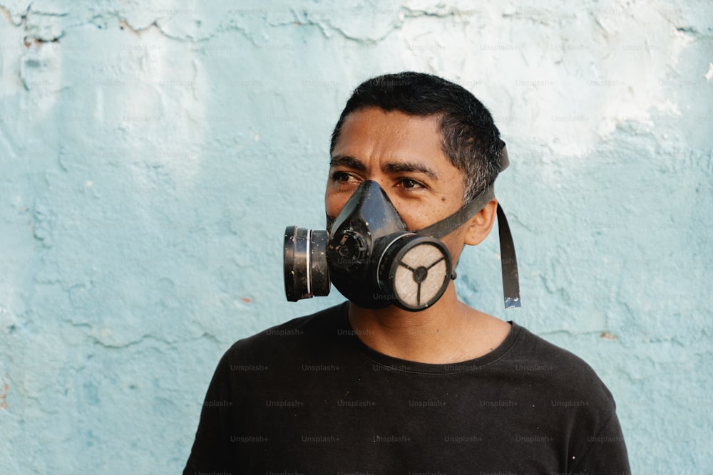 a man with a gas mask on his face