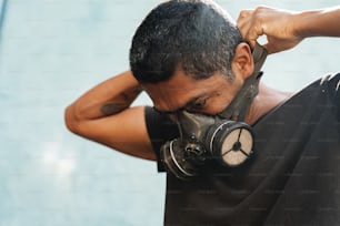 a man with a gas mask covering his face