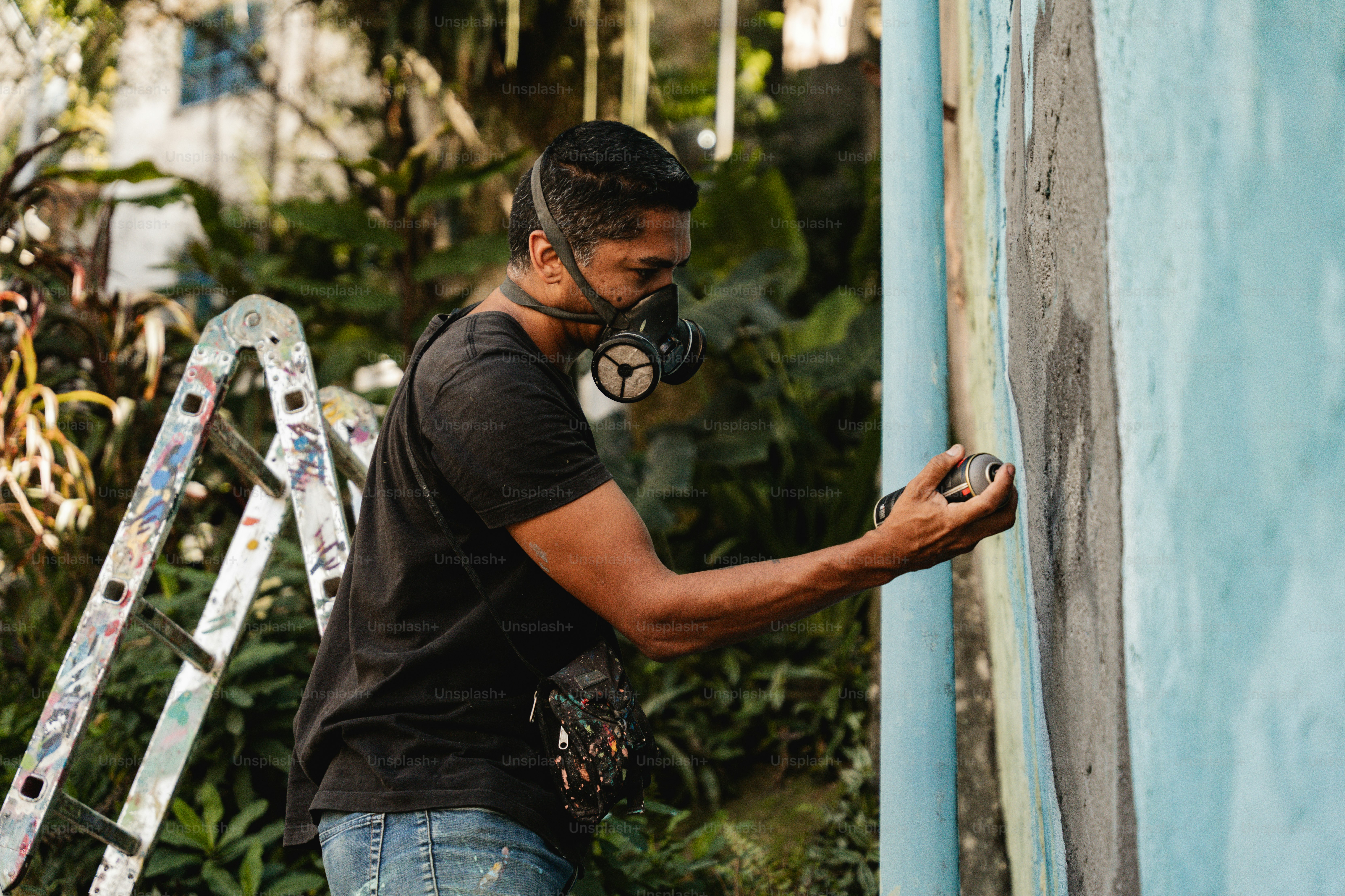 a man wearing a gas mask and holding a cell phone
