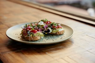 a white plate topped with food on top of a wooden table