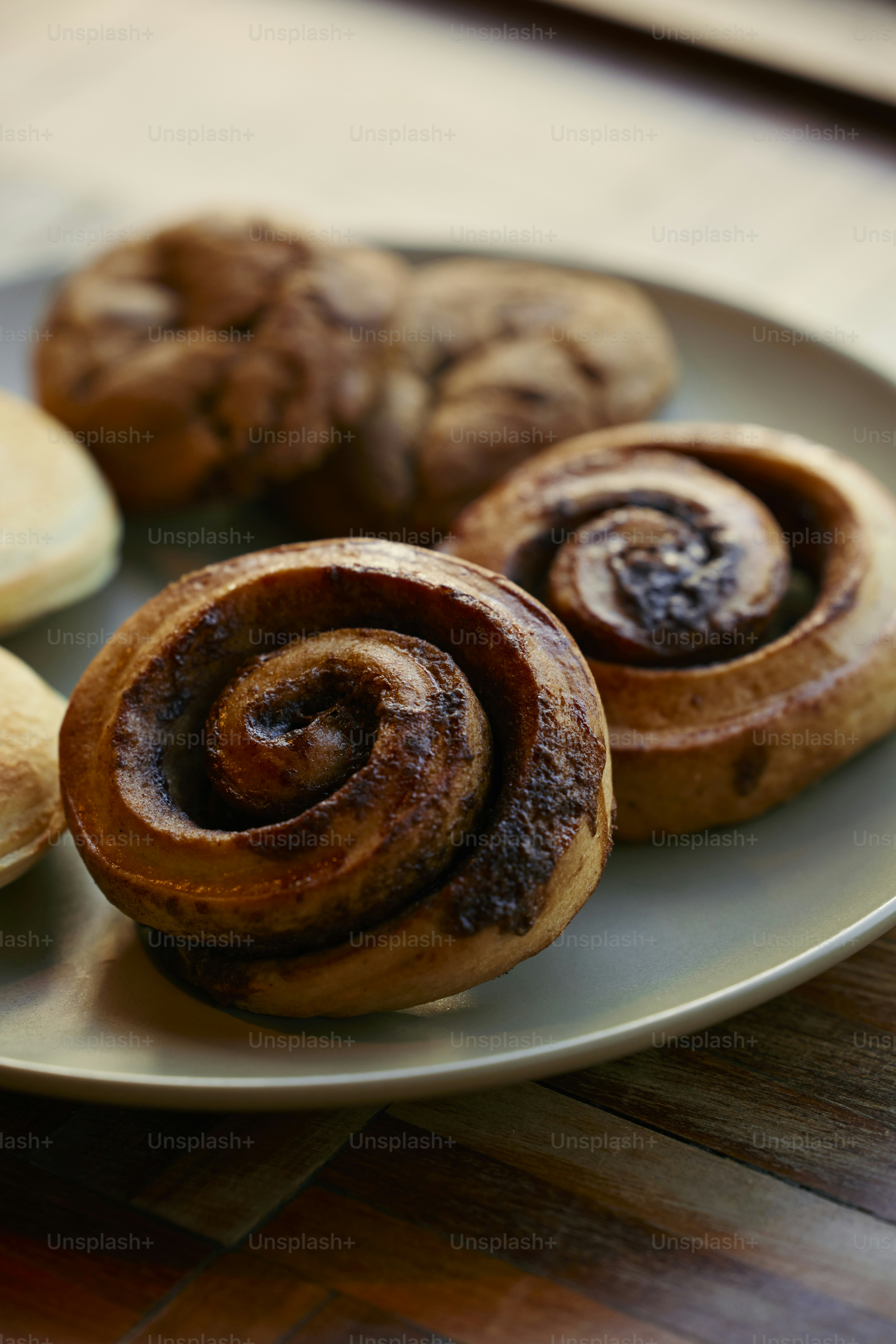 a plate of pastries on a wooden table