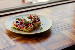 a plate of food on a wooden table