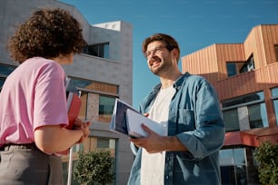 a man and a woman standing in front of a building