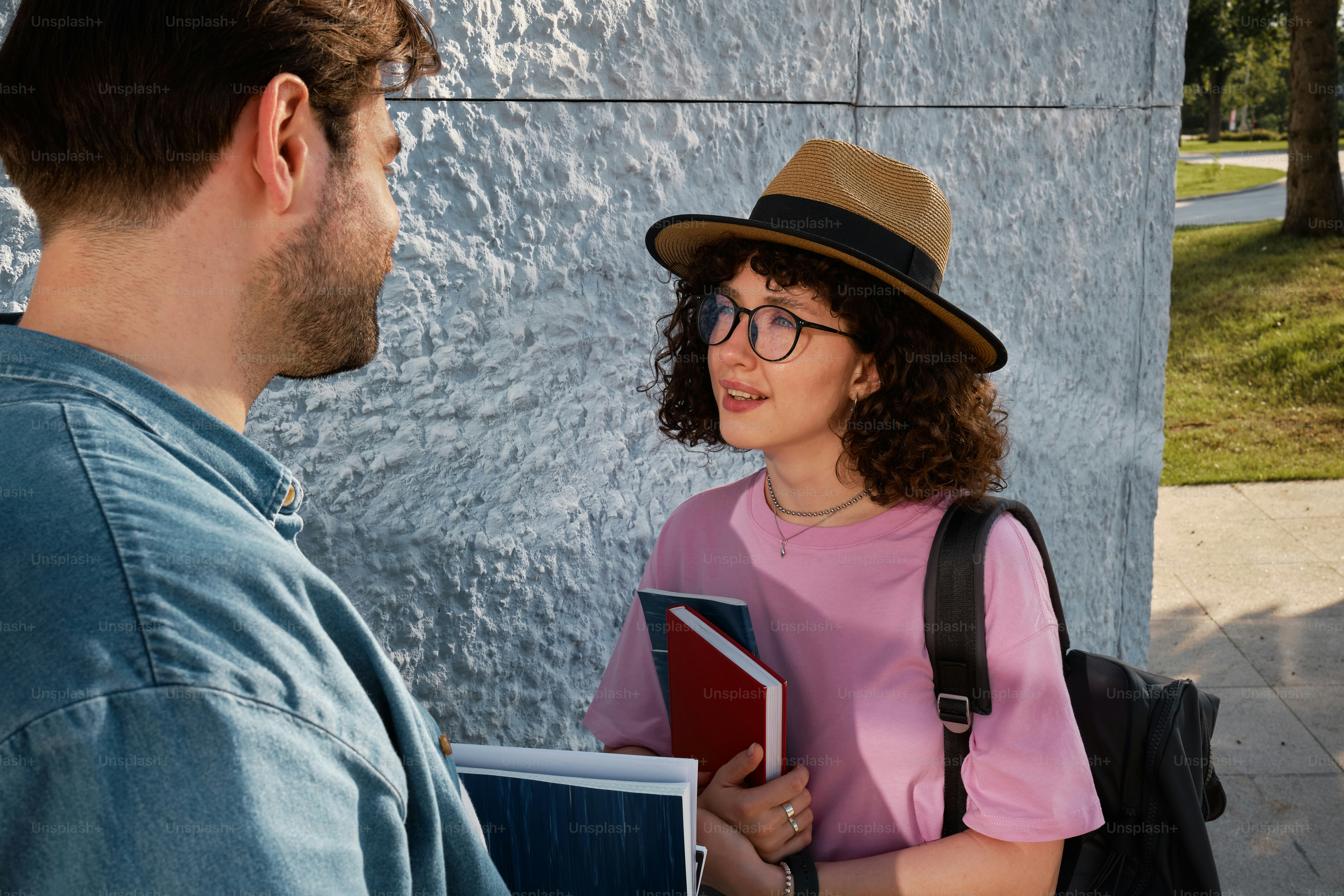 A man and a woman standing next to each other photo – College girl ...