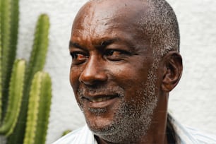 a close up of a person near a cactus