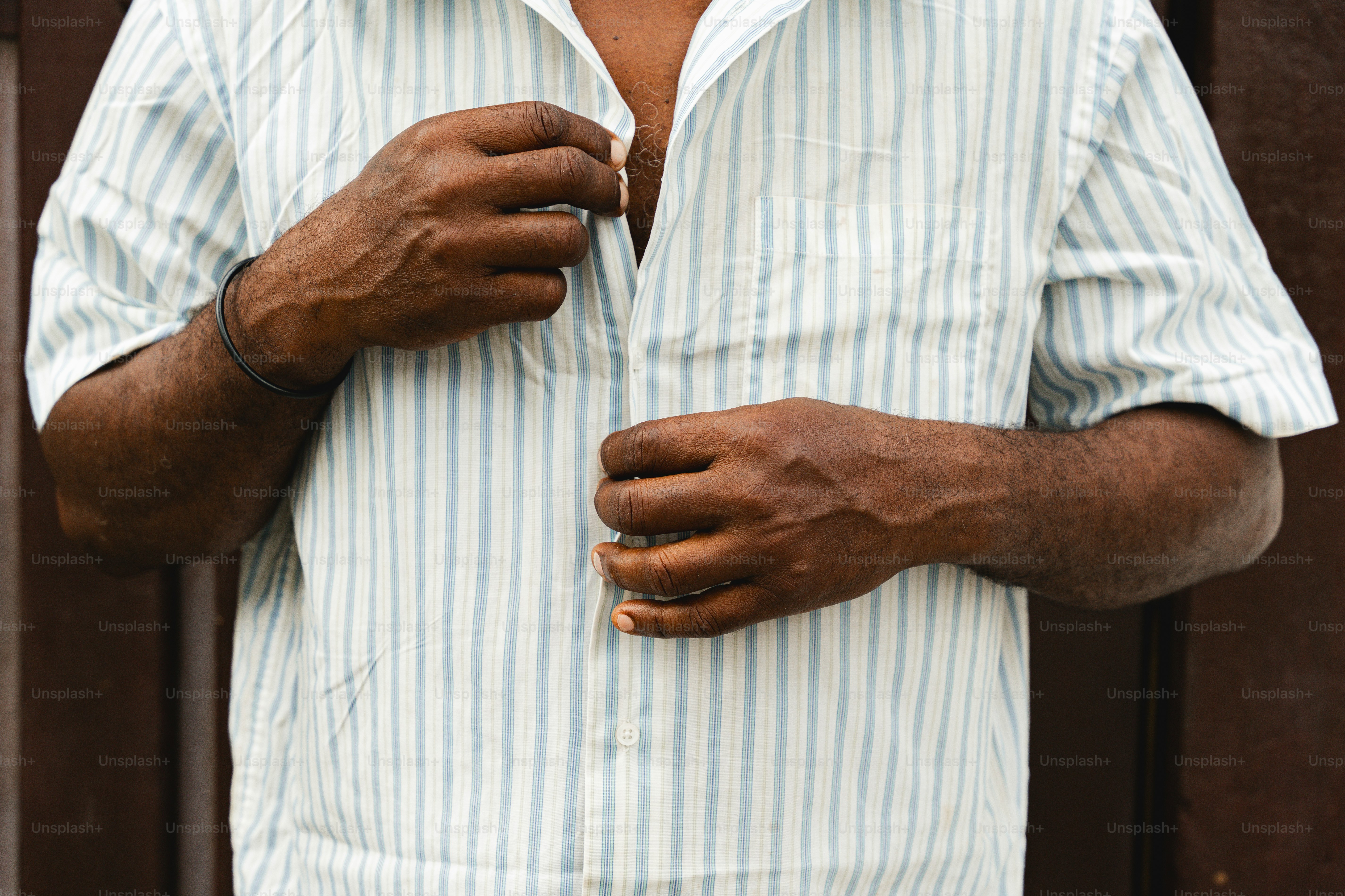 a man in a blue and white striped shirt