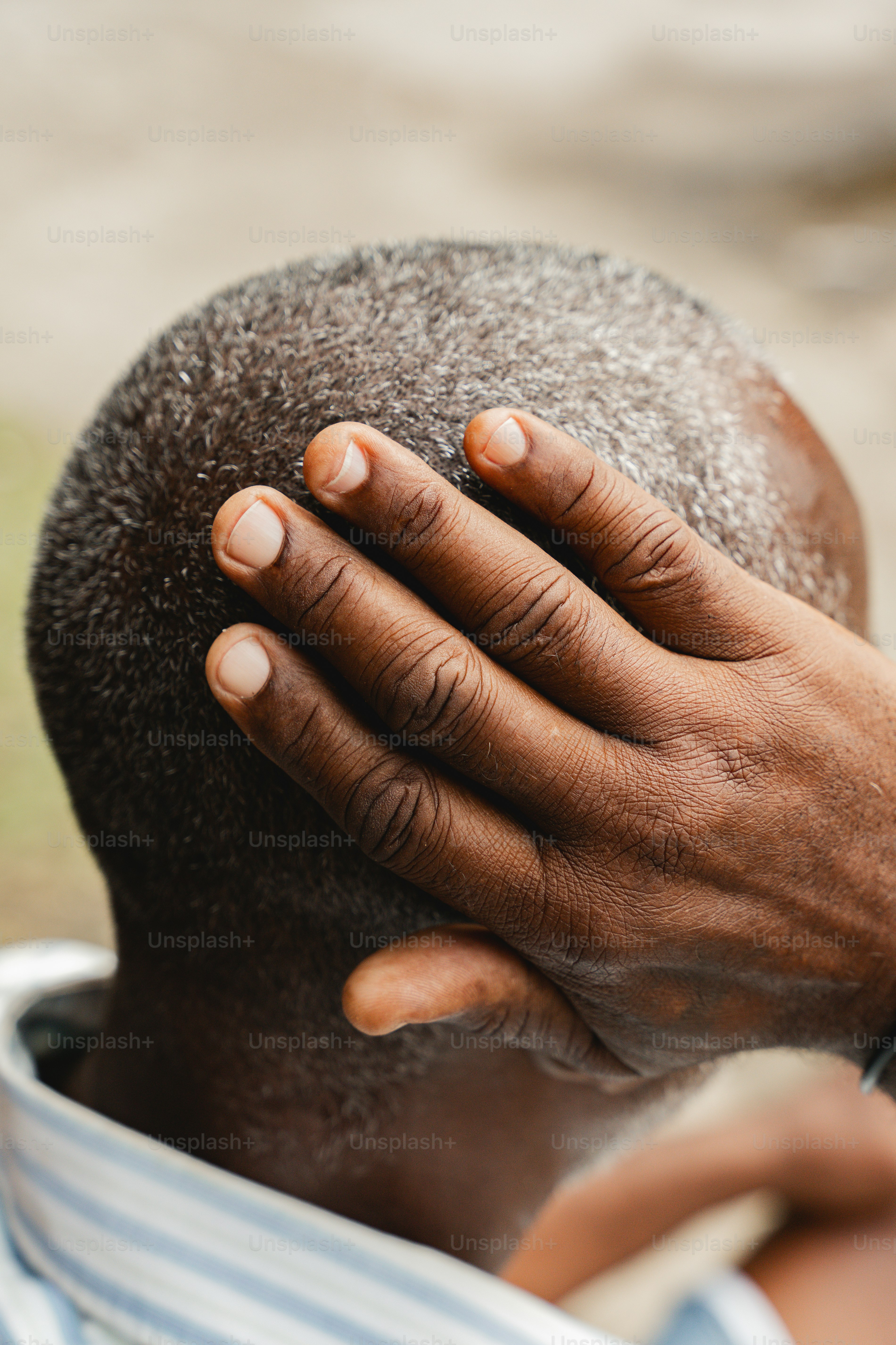 a man with his hands on his head