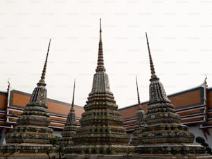 a row of ornately decorated buildings in front of a building