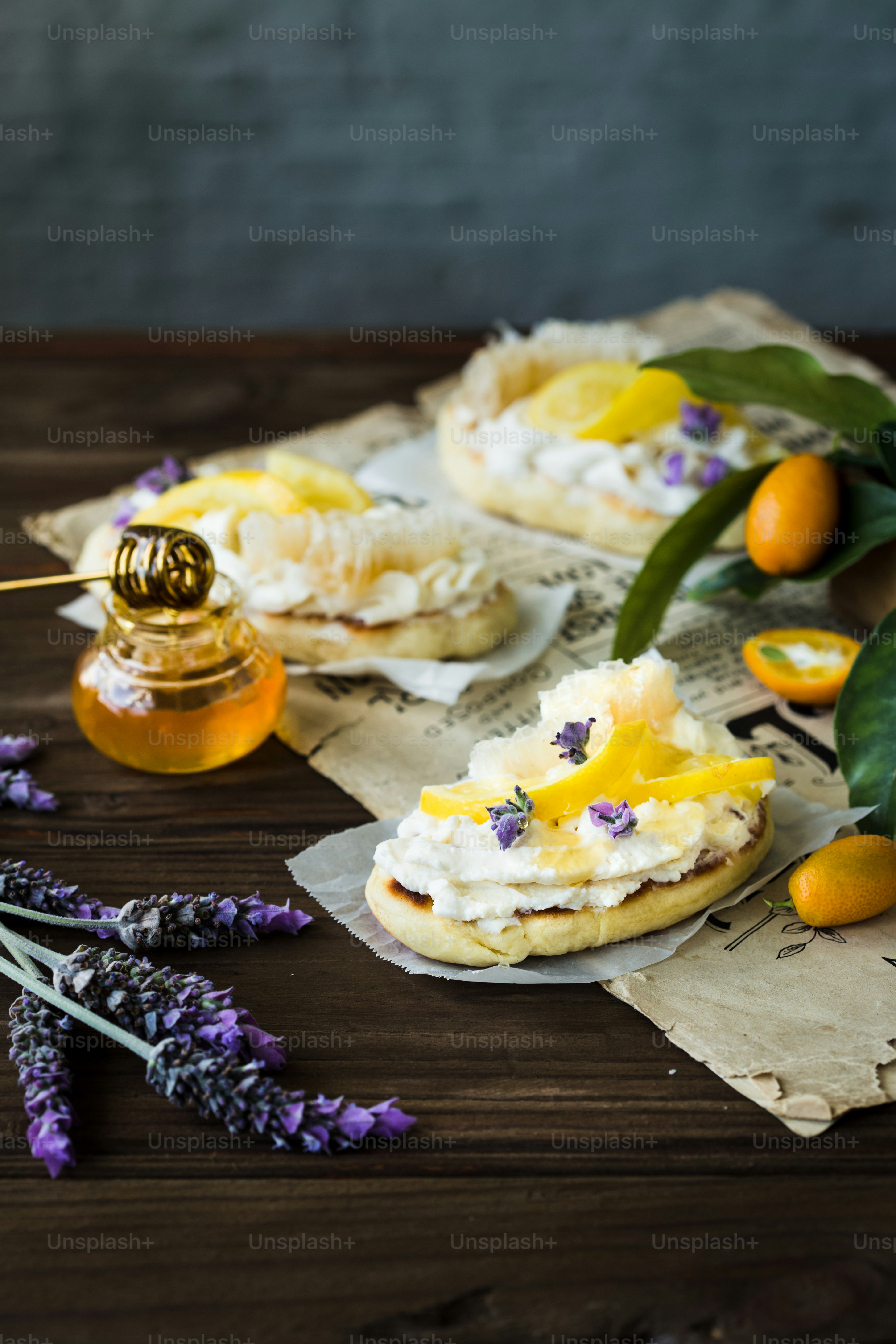 a wooden table topped with pastries and flowers