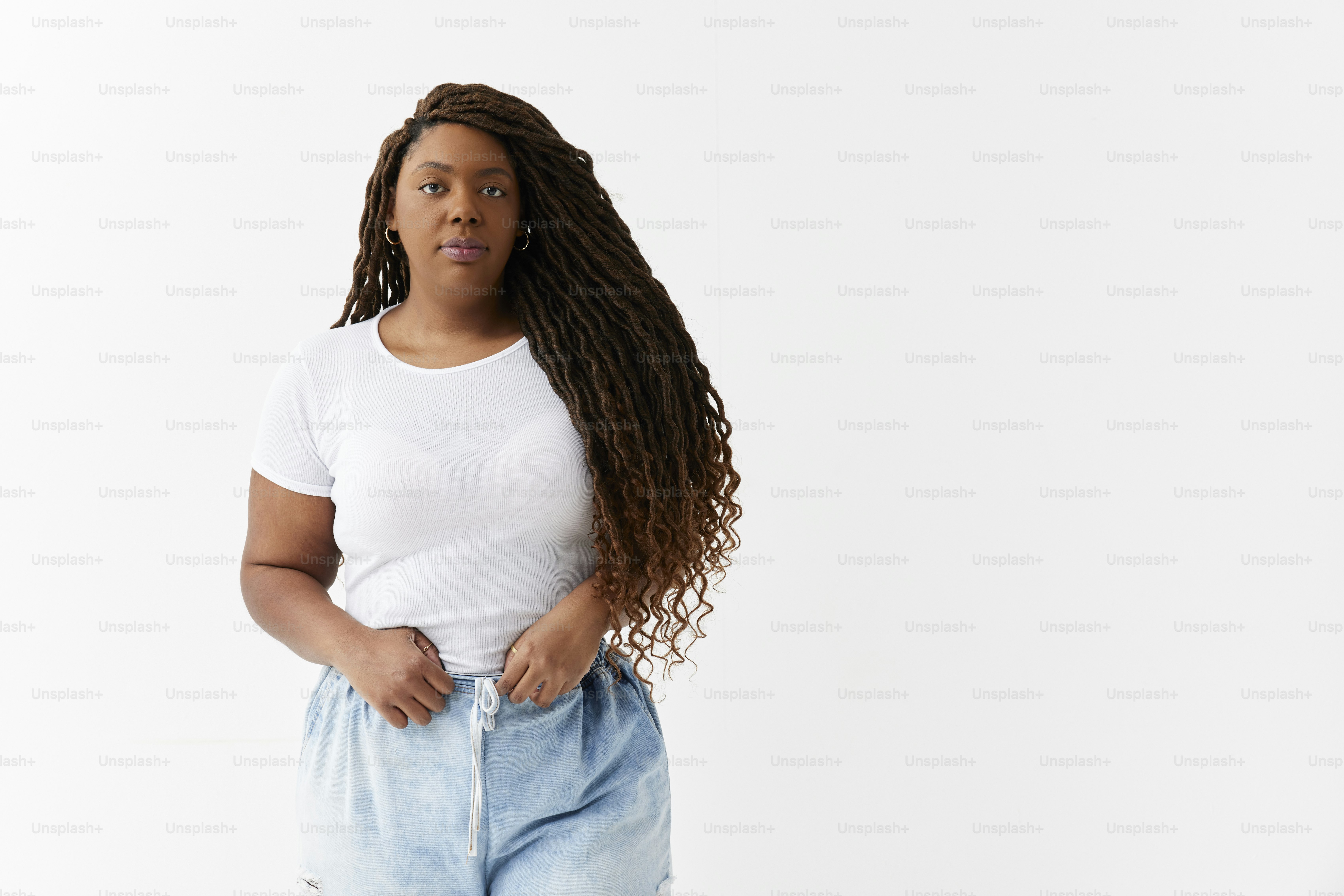 A woman in a white shirt is posing for a picture photo – Style Image on ...