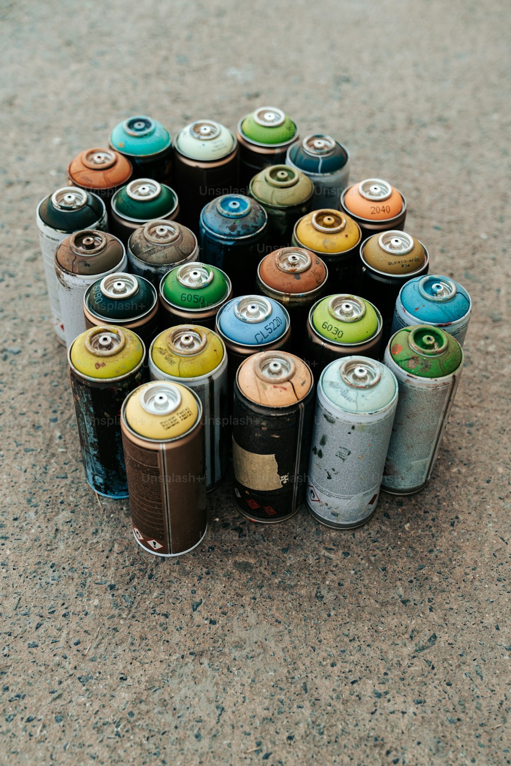 a bunch of cans that are sitting on the ground