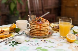 a stack of pancakes sitting on top of a table