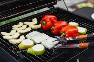 a person is cooking food on a grill