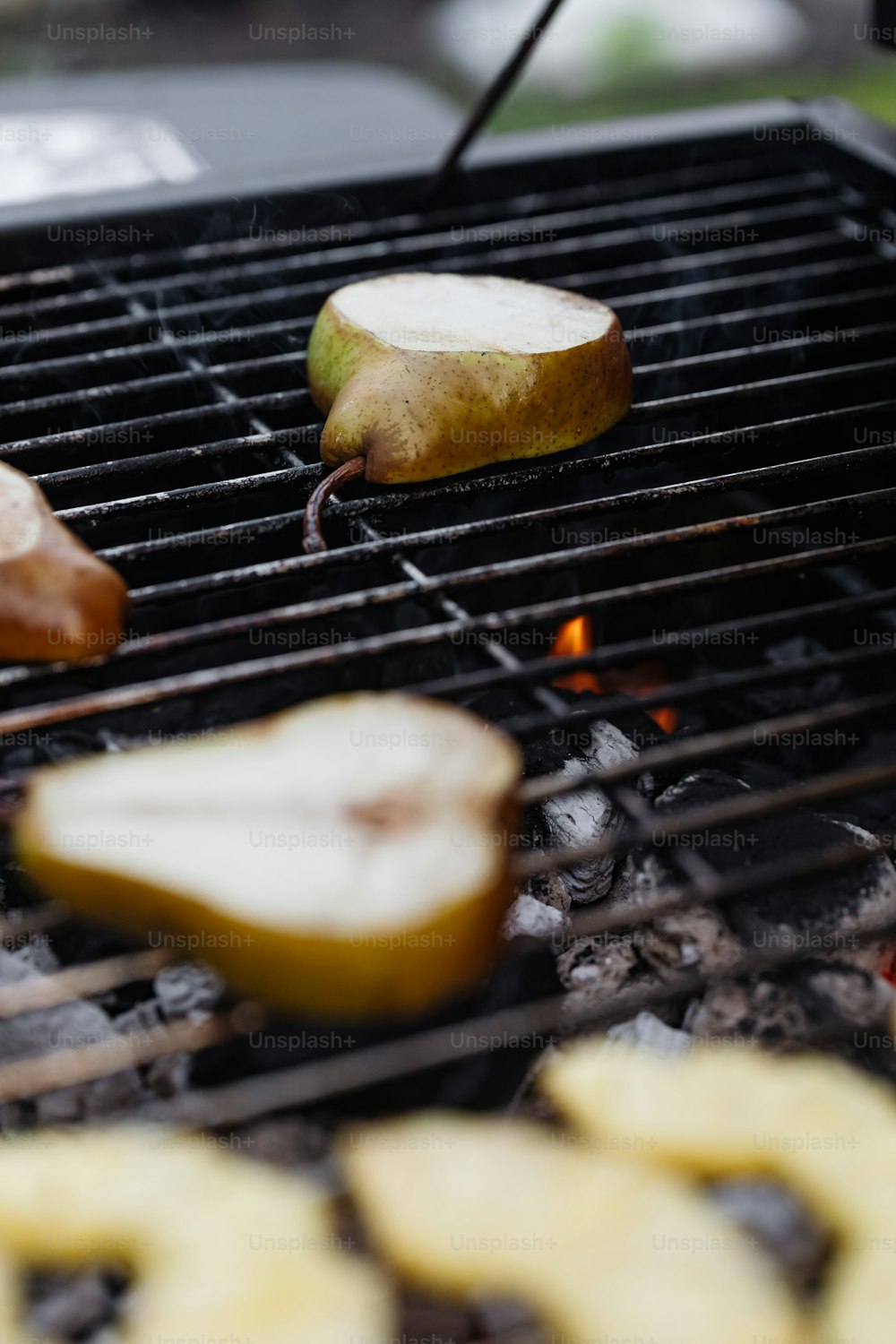 a close up of an apple on a grill