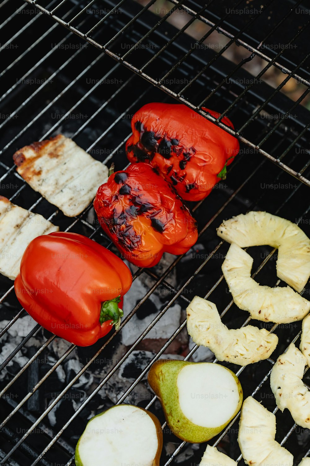 a close up of food cooking on a grill