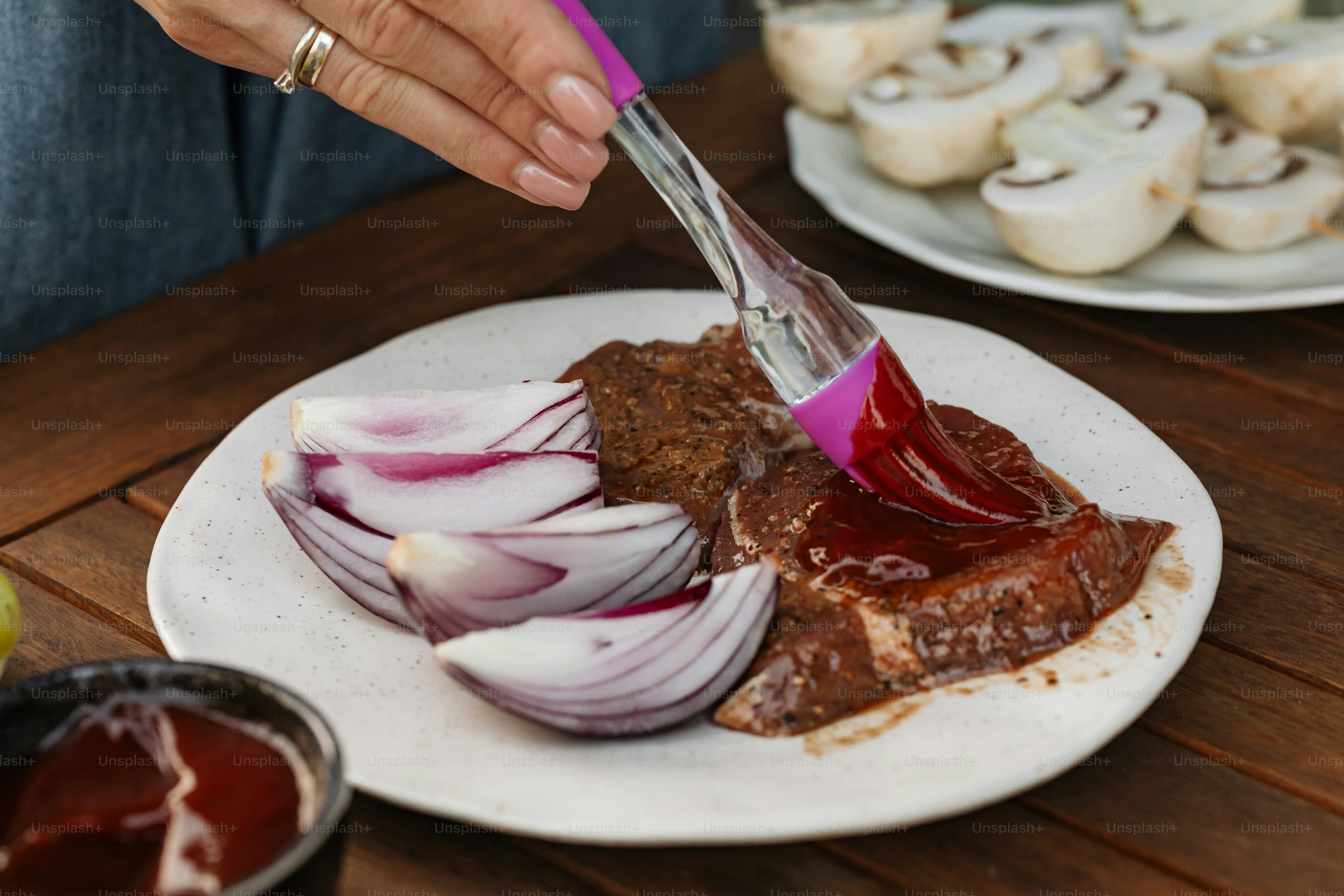 a person cutting up food on a plate