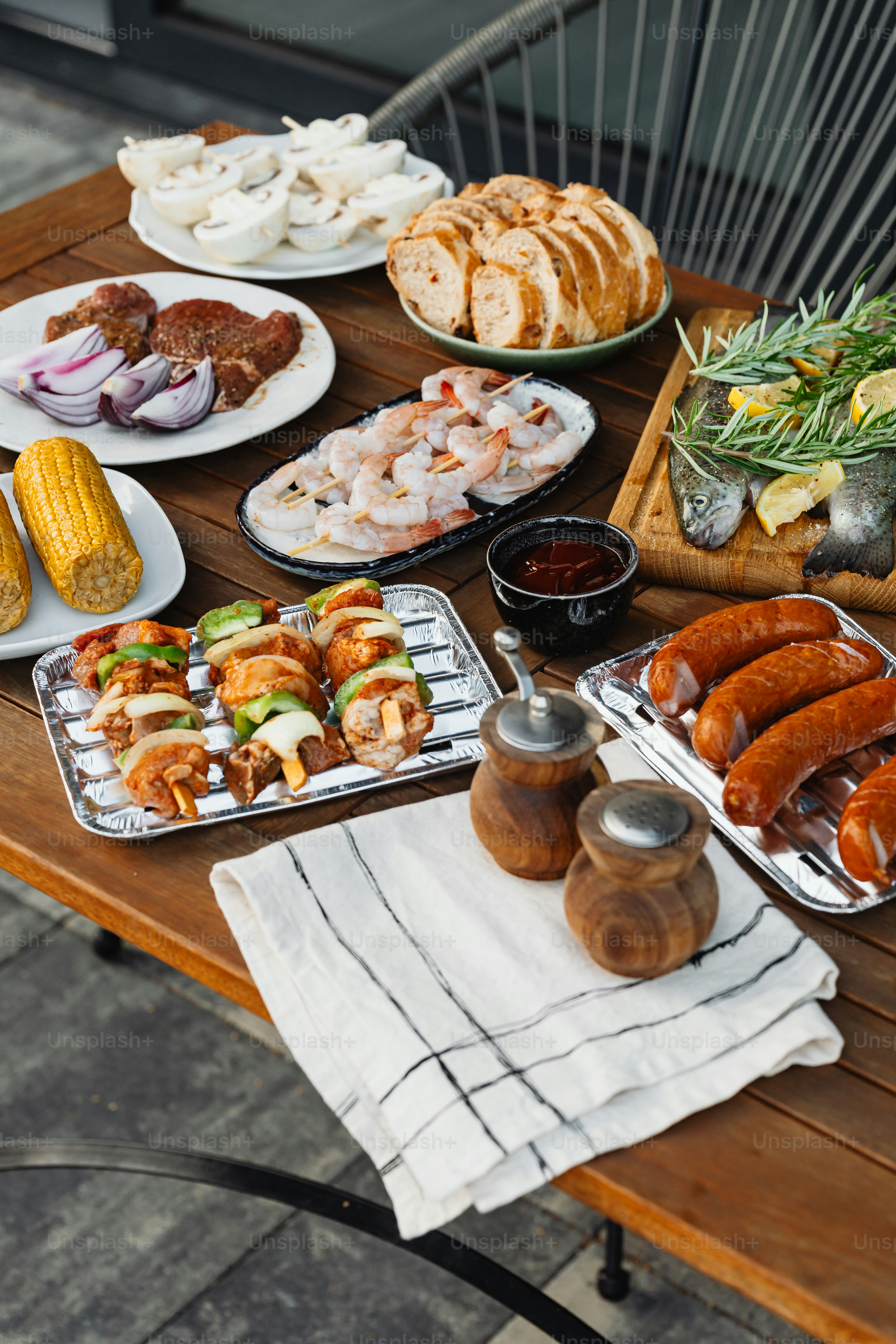 a wooden table topped with lots of food