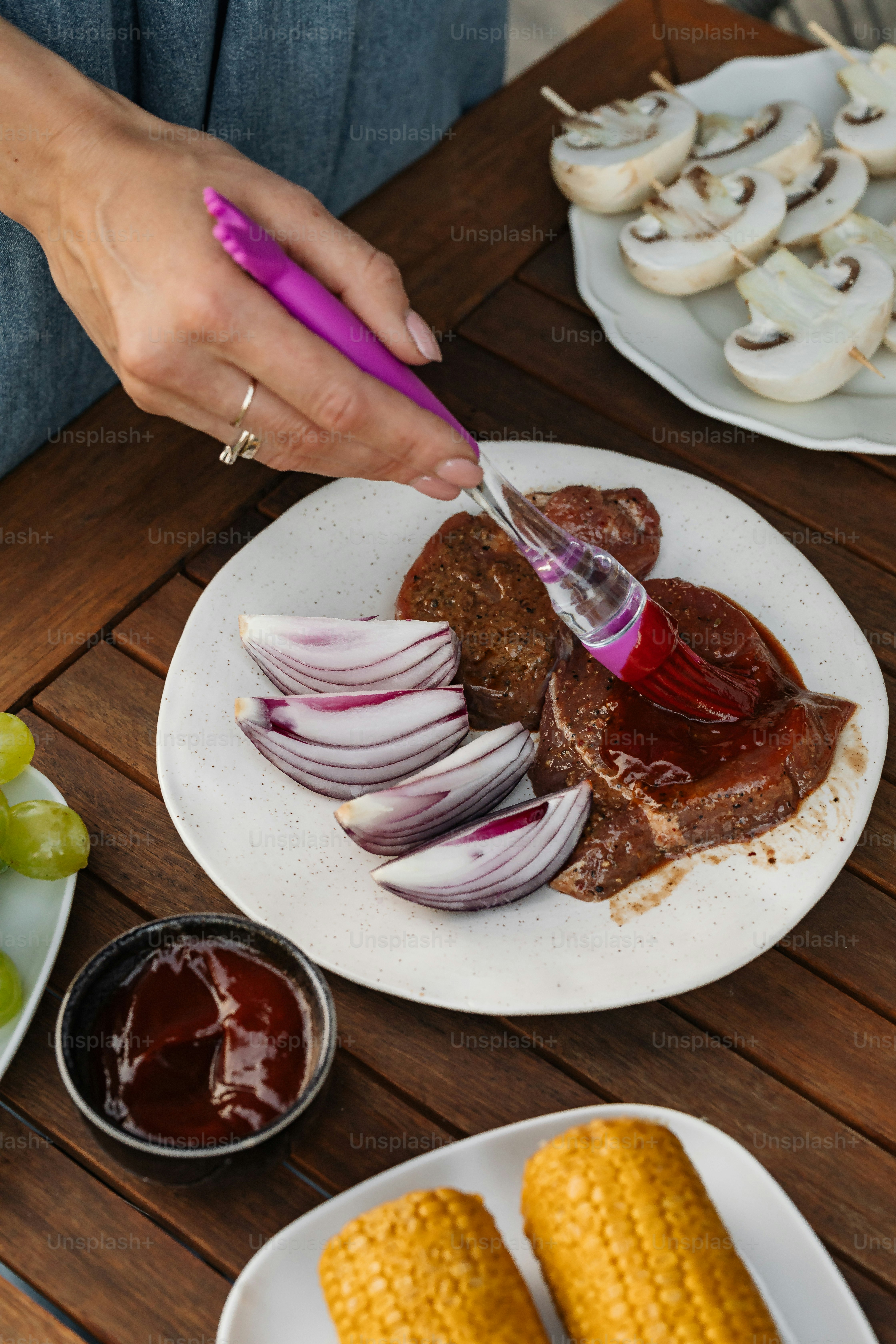 a person cutting up food on a plate