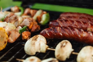 a close up of meat and mushrooms on a grill