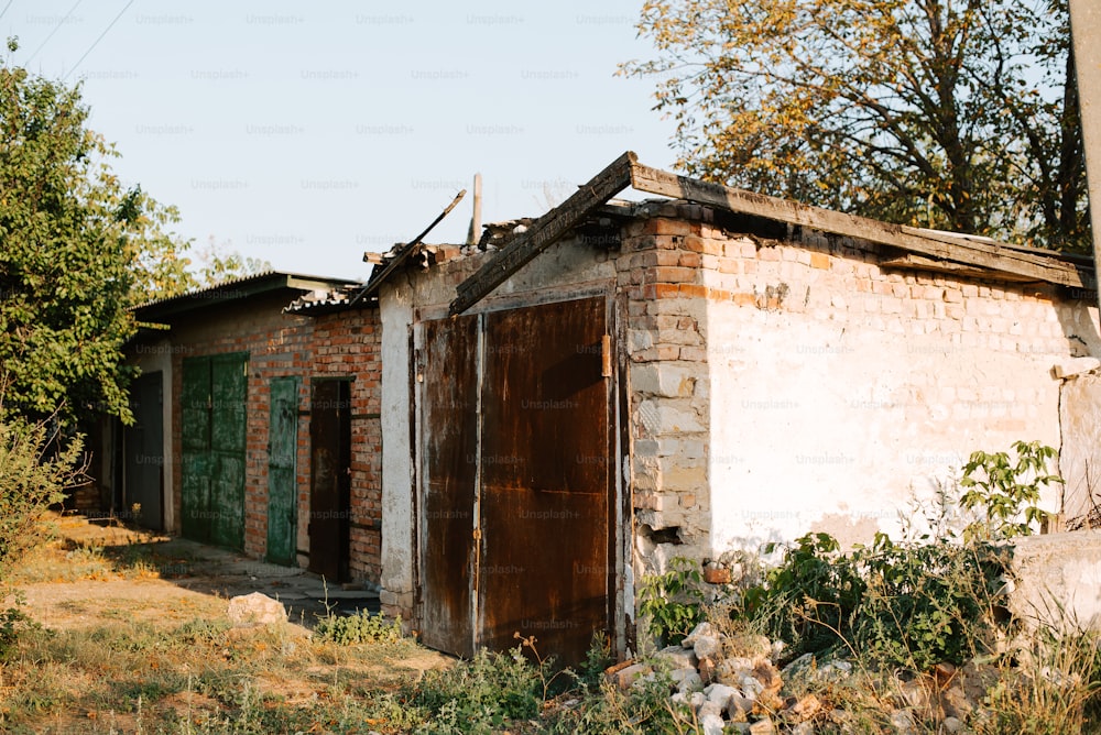 an old run down building with a broken door