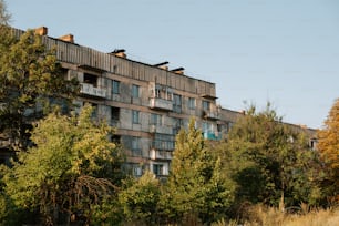 a tall building with lots of windows and balconies