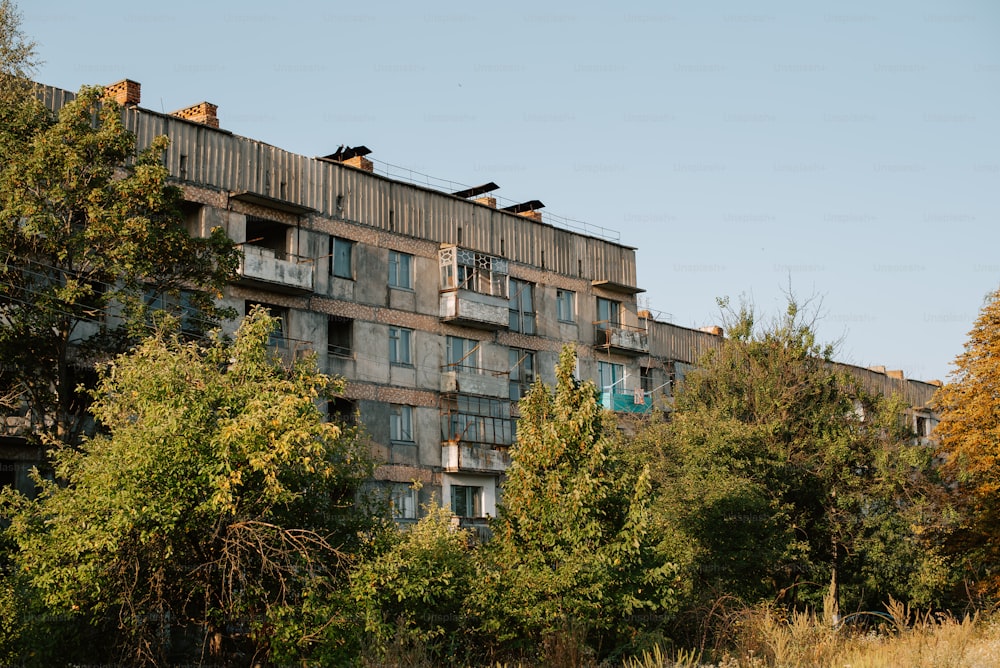 a tall building with lots of windows and balconies