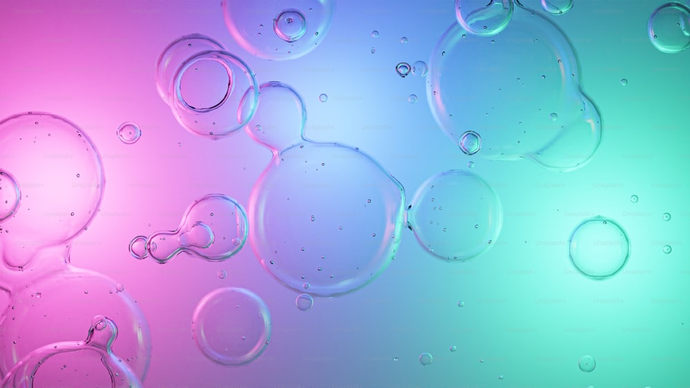 a group of bubbles floating on top of a blue and pink background