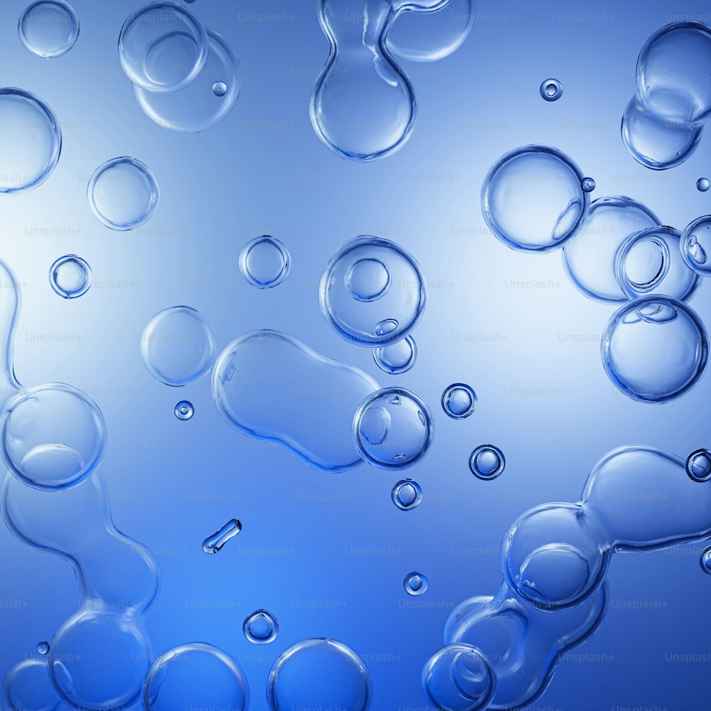 a group of bubbles floating on top of a blue surface
