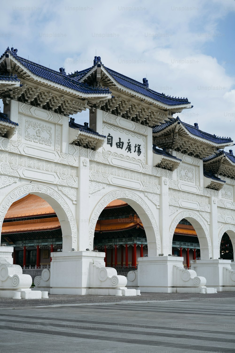 a large white building with a blue roof