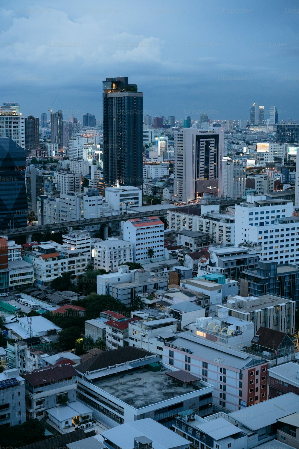 a view of a city at night from the top of a building