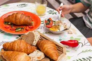 a woman sitting at a table with a plate of food