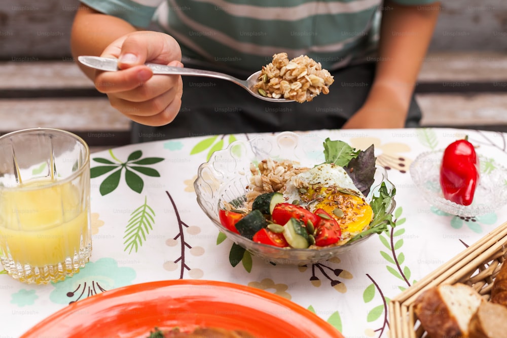 a person eating a bowl of food on a table