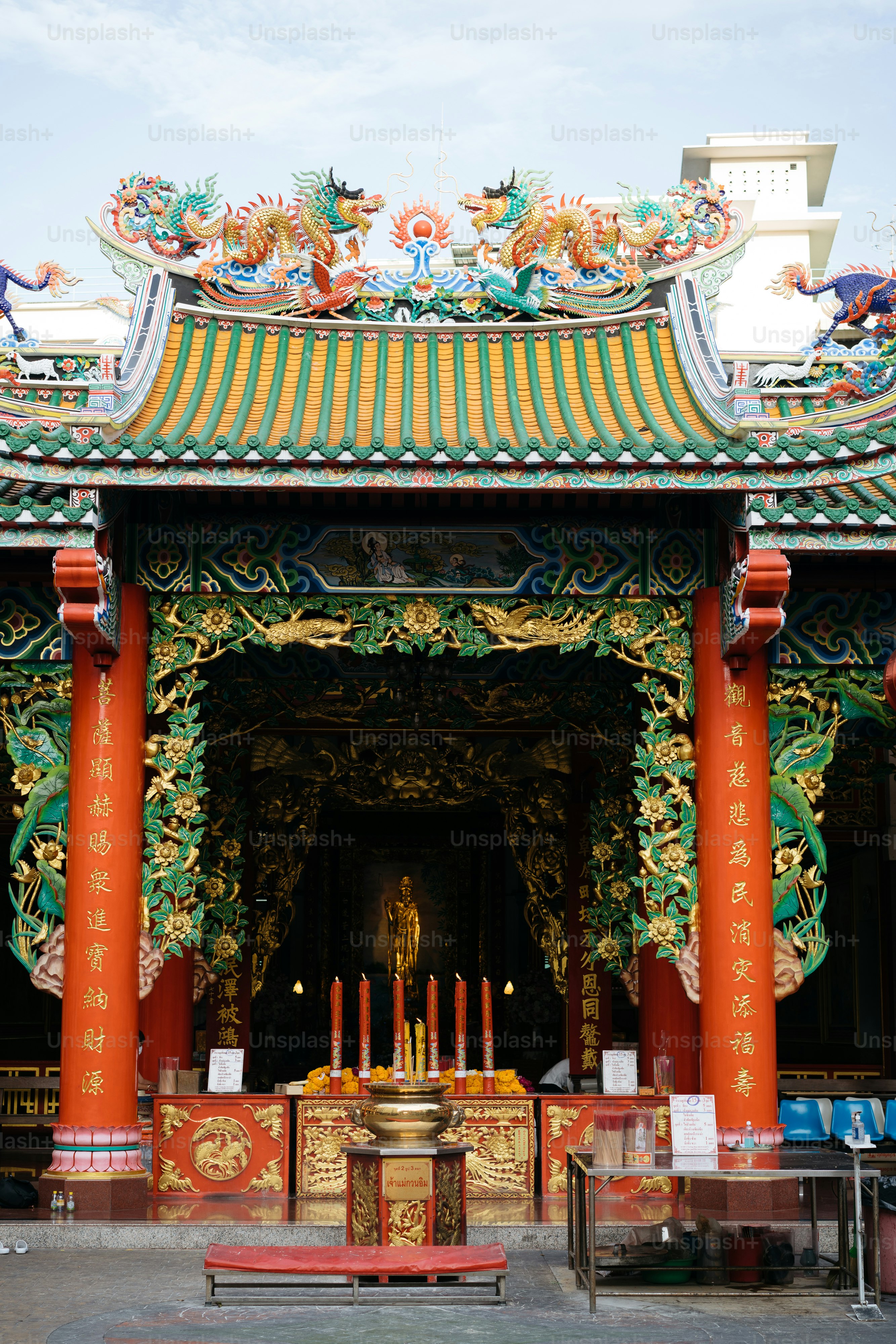 a chinese temple with a shrine in the middle of it