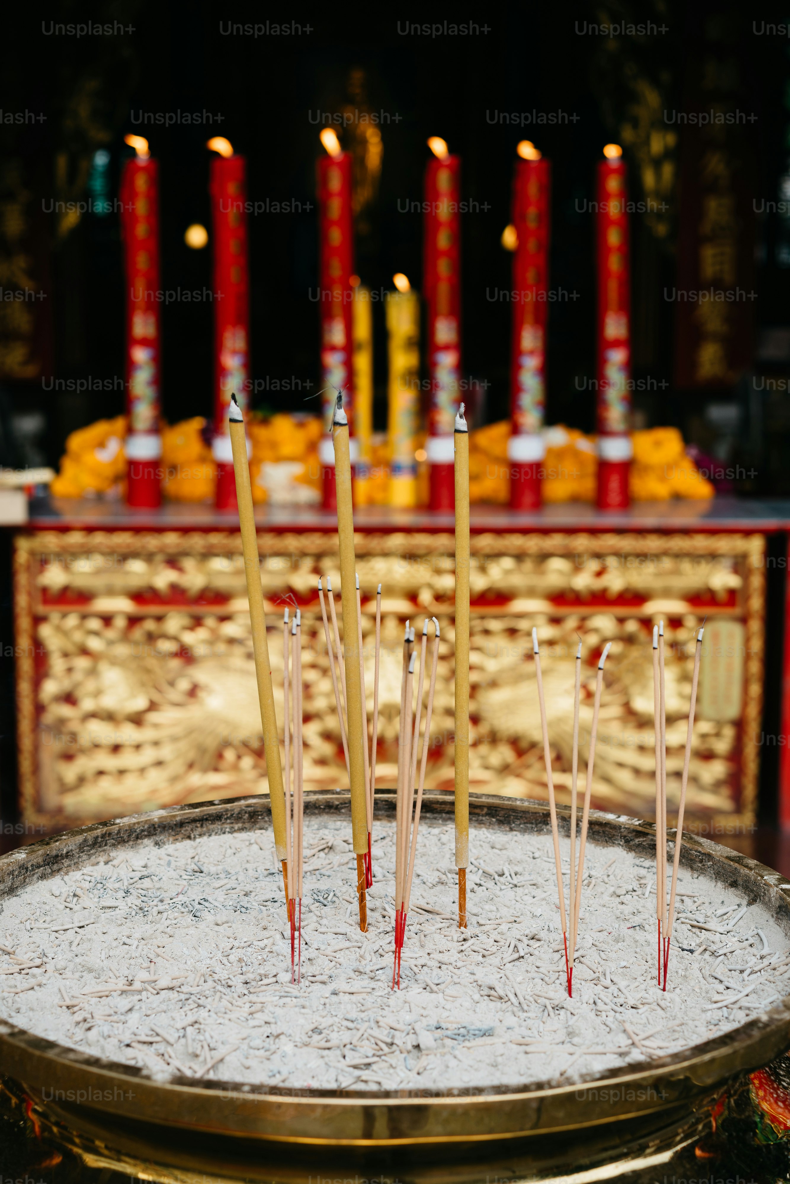 a tray of incense sticks on a table