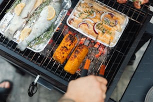a person cooking food on a grill on a grill