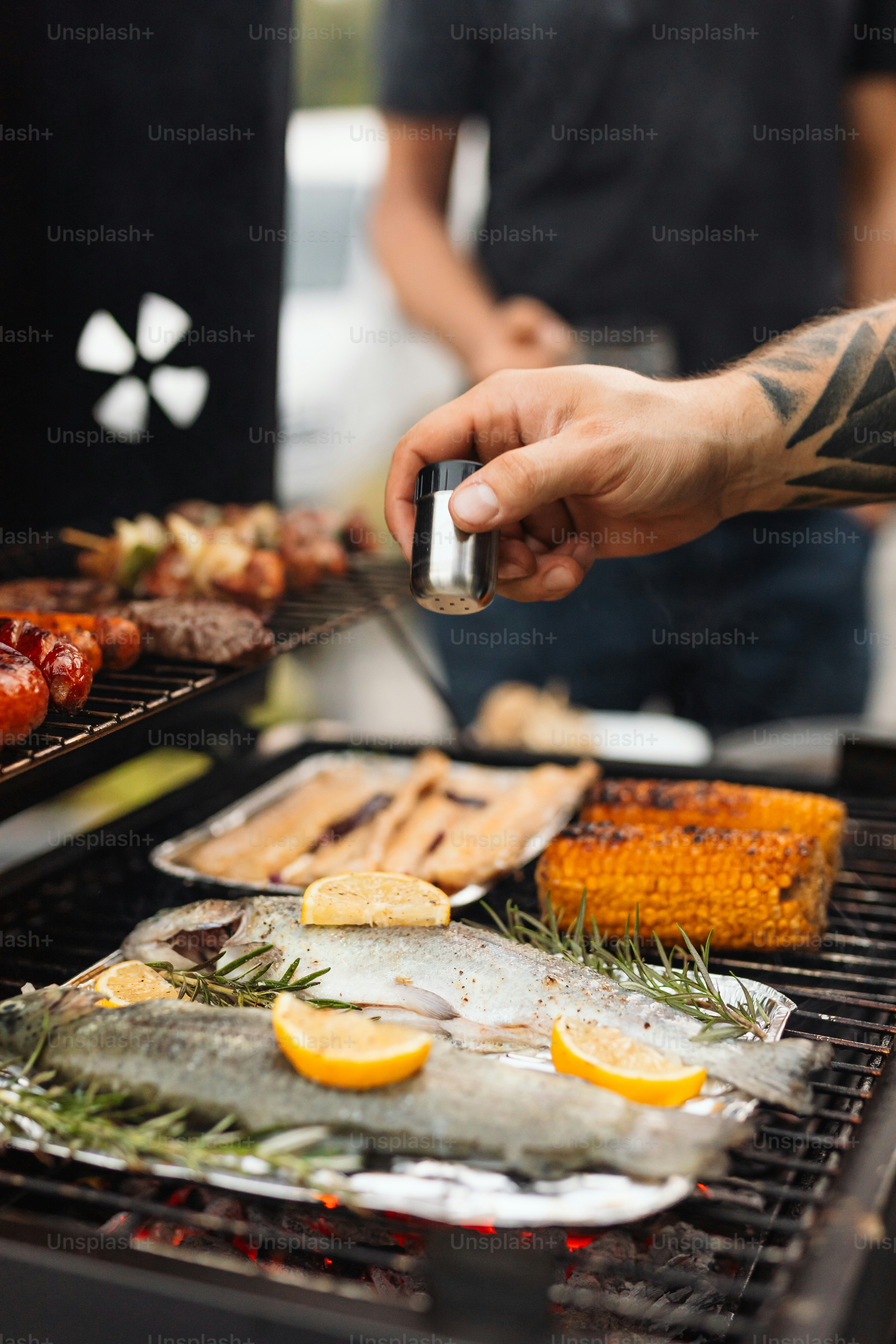 a person is cooking food on a grill